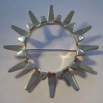 Tone Vigelund sunburst silver brooch